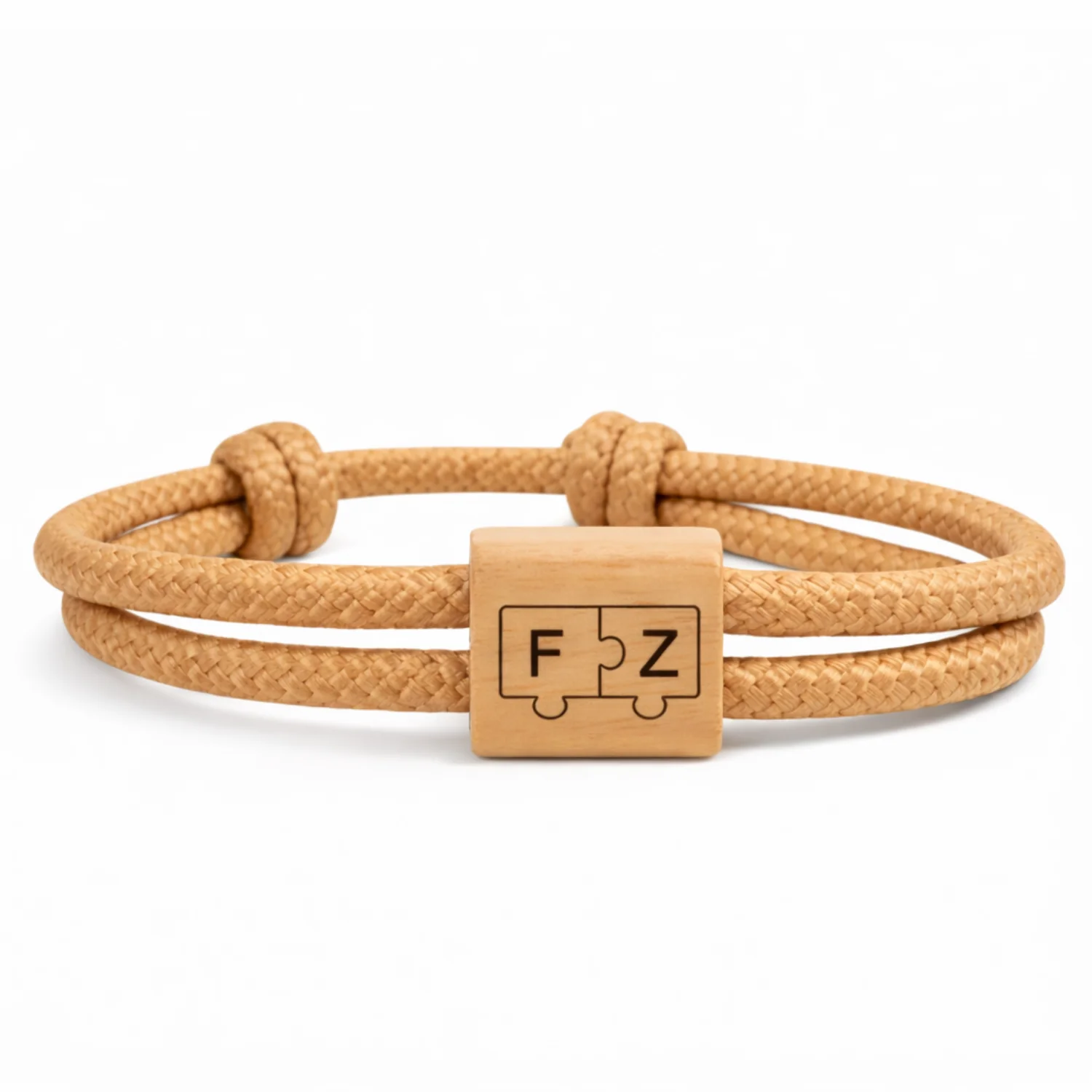 Deux pièces de puzzle gravées des initiales F et Z, cordon caramel